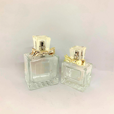 50ml 100ml ขวดน้ำหอมสวยหรูขวดแก้วโลหะผสมโบว์สเปรย์ขวดเปล่าการจับคู่การปรับแต่งโรงงาน
